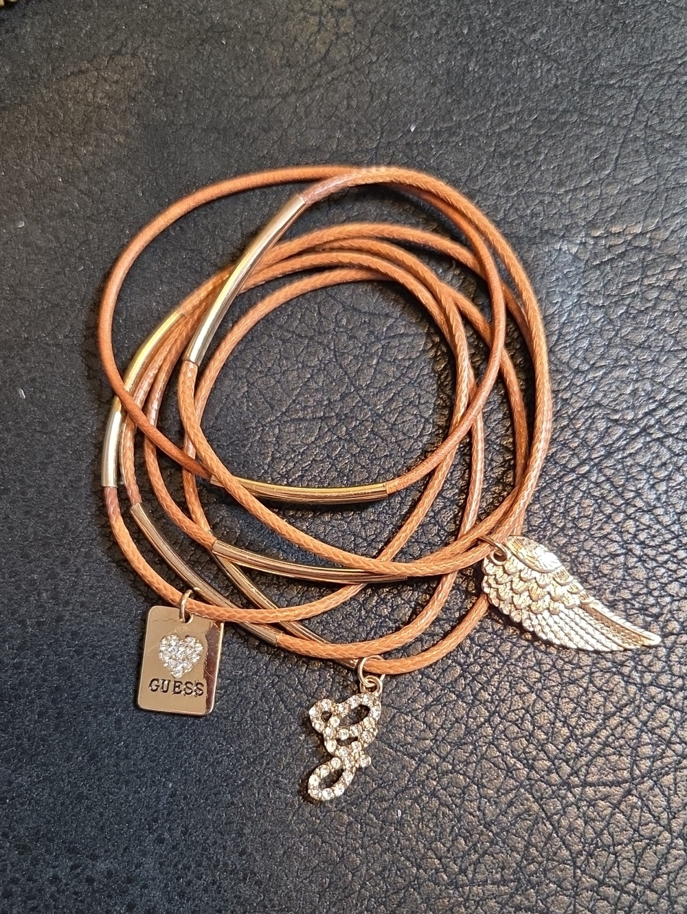 GUESS Tan MultFaux Leather Stack Bracelets with Goldtone/Crystal Charms.  * 6 *